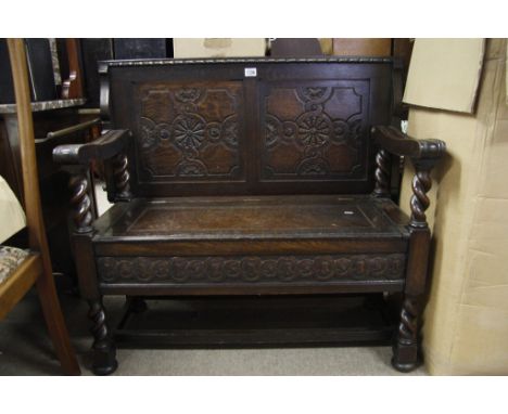 An oak monks bench hall seat with hinged and sliding back/top