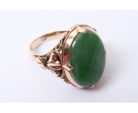 A 14ct gold ring set with a jade stone