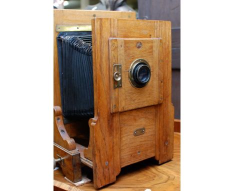 A large oak and black painted metal projector 'The King Enlarger' London