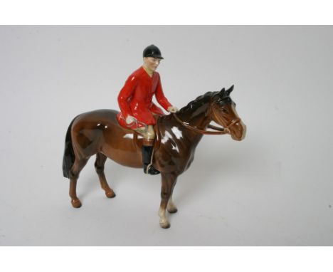 A Beswick horse and rider in hunting attire