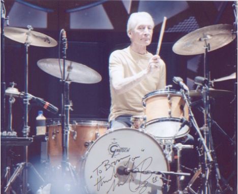 Rolling Stones - Charlie Watts. A dedicated 10x8 picture of Watts behind the drums. Excellent.  Good condition. All signed it