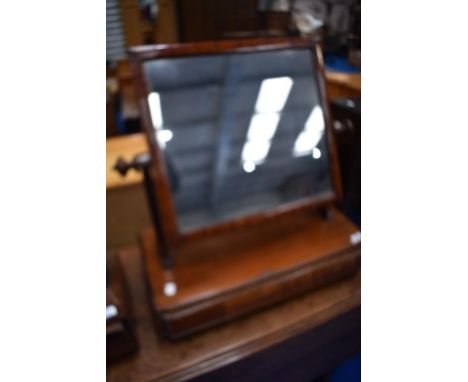 A Victorian mahogany toilet mirror with drawer base