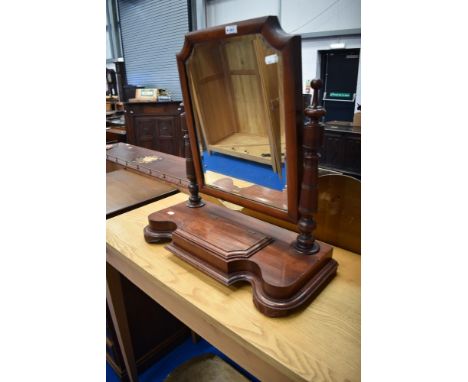 A Victoriann mahogany toilet mirror on trinket base