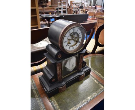 A Victorian black slate and rouge marble mantle clock having enamelled roman numeral dial