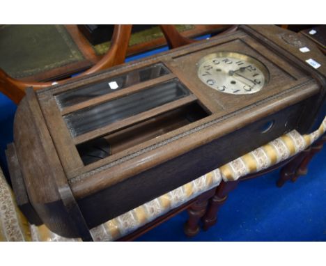 An early 20th Century oak cased wall clock