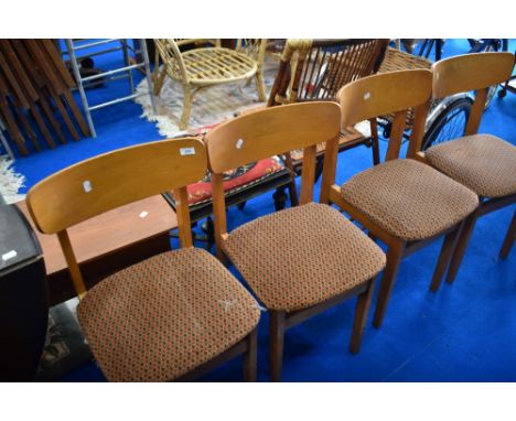A set of four vintage dining chairs