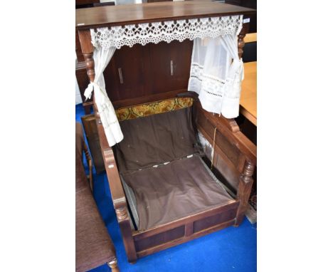 A vintage Sedan style oak chair, upholstery removed to comply with fire regulations