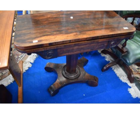 A William IV rosewood fold over card table on typical platform base