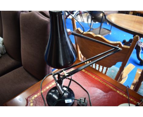 A vintage angle poise lamp