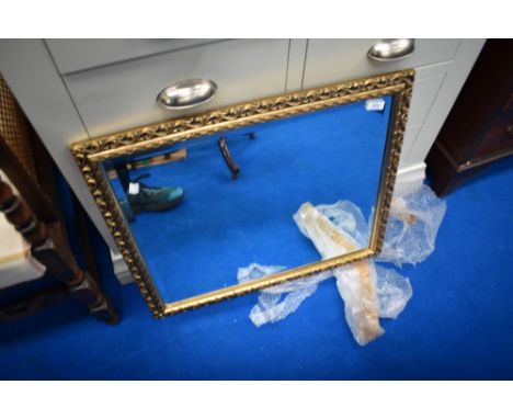 A gilt frame wall mirror