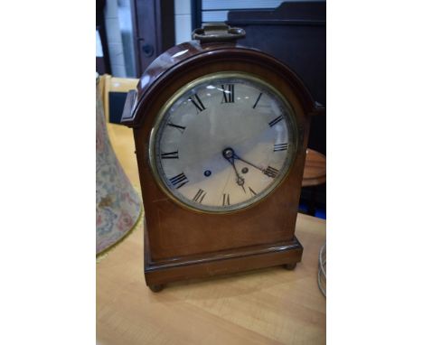 An Edwardian mahogany bracket clock having silvered Roman numeral dial, movement stamped , W &amp; H, SCH