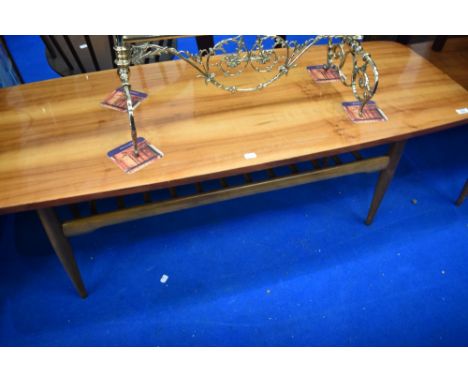 A vintage coffee table having polished top and slatted undertier, approx 137 x 50cm