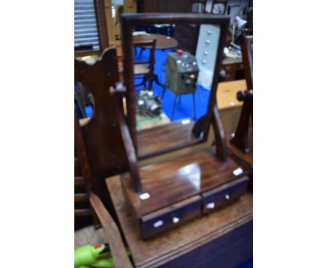 A Victorian mahogany toilet mirror with drawer base