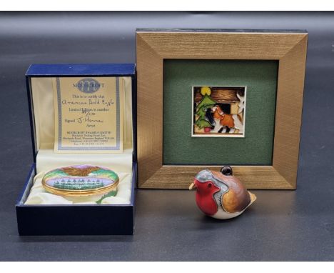 A Moorcroft robin Christmas tree hanging decoration,&nbsp;4cm high; together with another Moorcroft Christmas plaque, 4.5cm s