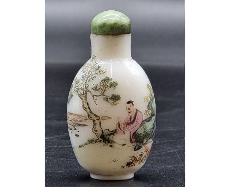 A Chinese famille rose glass snuff bottle and jade stopper,&nbsp;7cm high.&nbsp; 