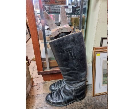 A pair of vintage black leather gentleman's riding boots, approx size 7/8; together with a boot jack.&nbsp; 