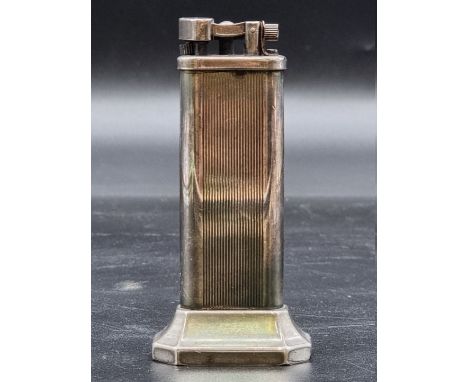 A vintage Dunhill silver plated 'tallboy' table lighter,&nbsp;10cm high. 