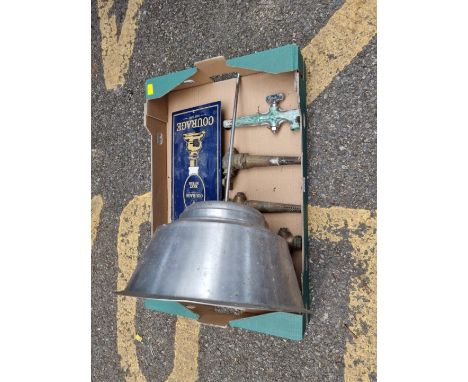 Three old beer taps and a industrial type light fitting.&nbsp; 