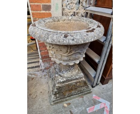 A large and impressive weathered composition stone pedestal planter, on stepped square base, 84cm high x 64cm diameter. 