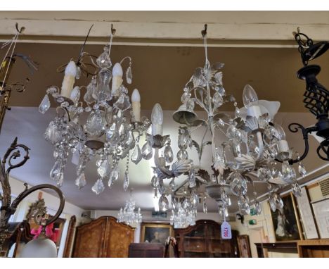 A white painted and faceted drop five branch ceiling light,&nbsp;55cm high; together with a pair of matching wall lights; and