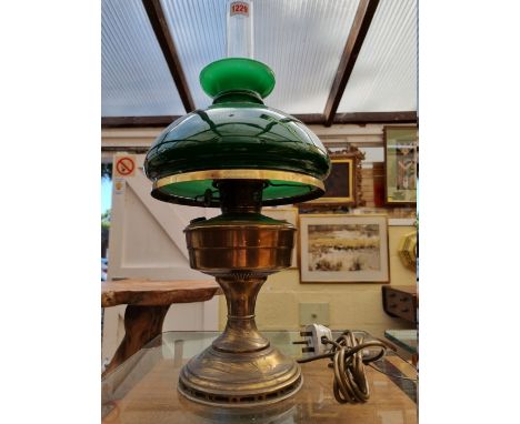 A brass and green glass table lamp, (electrified), height excluding chimney 41cm.&nbsp; 