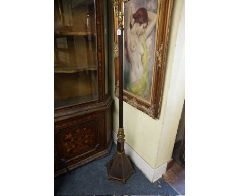 An oak and brass standard lamp,&nbsp;with fluted column and tapered hexagonal base. 