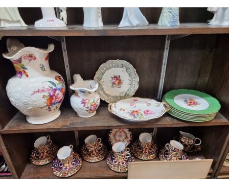 A collection of English floral painted porcelain, to include two Victorian Coalport jugs, largest 34cm high; and a set of six
