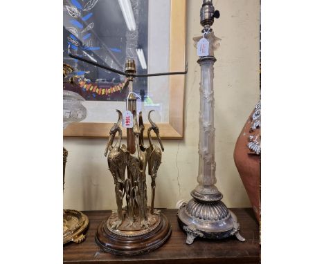 An old brass table lamp, modelled with five herons; together with another frosted glass and electroplate table lamp. (2) 