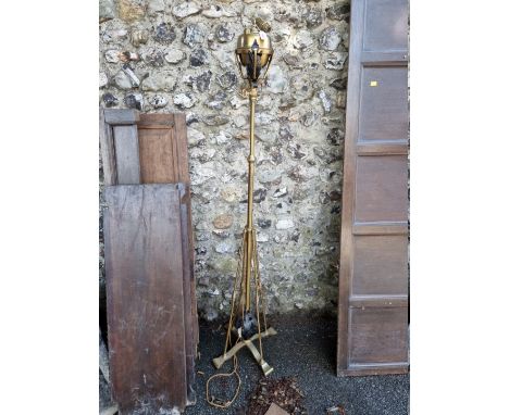 A brass adjustable standard lamp.&nbsp; 