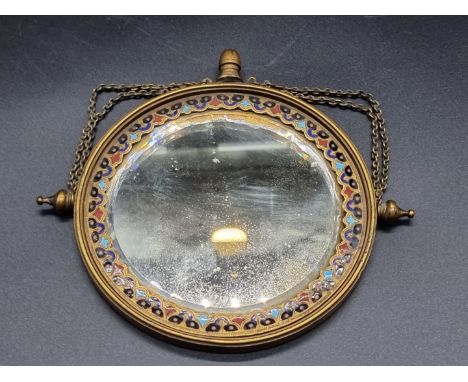 A continental gilt brass and champleve enamel circular mirror,&nbsp;13.5cm diameter. 