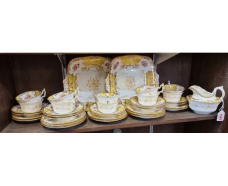 A Coalport 'Y2665' pattern part tea service, comprising: two twin handled plates, (both s.d.); sugar bowl; cream jug; twelve 