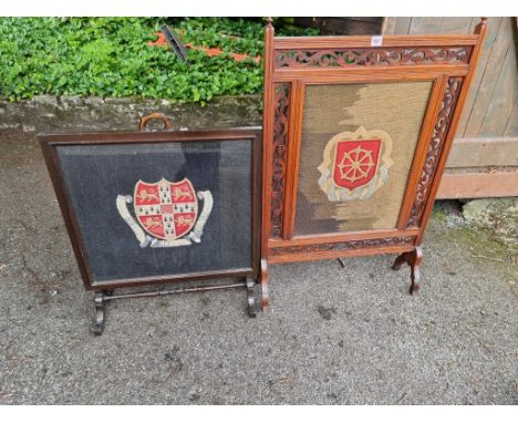 Two gros point panel fire screens, one decorated with the arms of Cambridge University, 67cm wide; the other of St Catharine'
