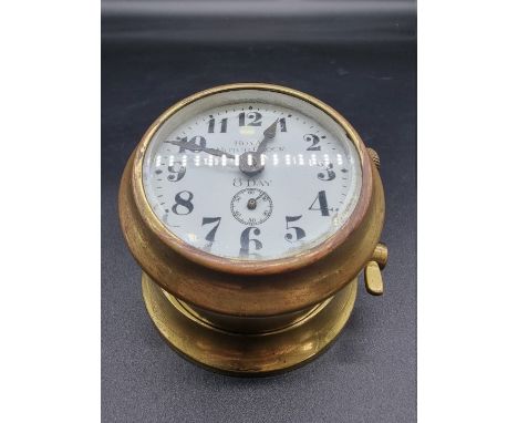 A vintage 'Royal Motor Clock' brass timepiece, with&nbsp;2 1/2in dial. 