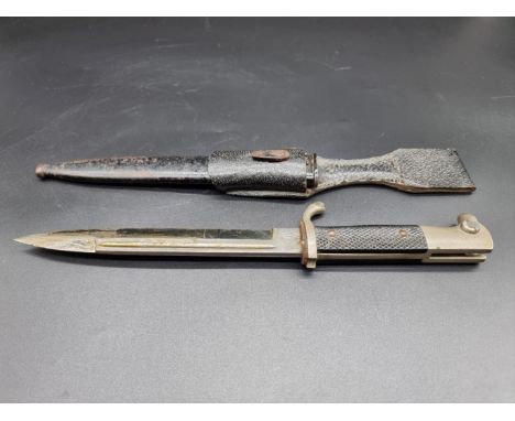 A German World War II 98k short dress bayonet and scabbard, by F W Holler, Solingen, having 20cm blade, with leather frog. 