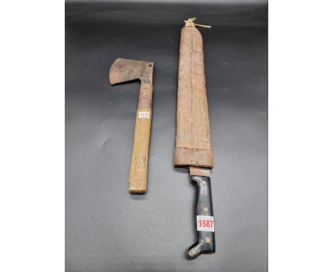 A machete and scabbard, with plastic grip and 49.5cm blade; together with an old hatchet. (2) 