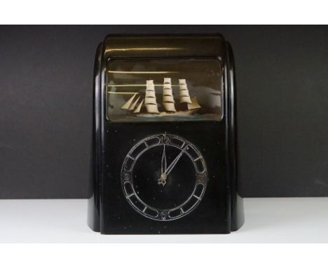 Art Deco Vitascope Electric Automaton Clock, the black bakelite case with silvered dial and window showing a sailing ship on 