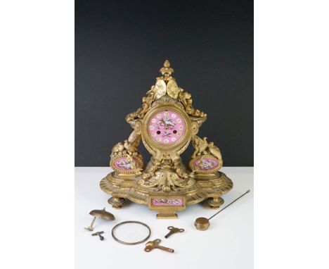 19th century French 8 day Mantle Clock, the gilt metal case cast with doves and foliate swags, the painted pink ground face d