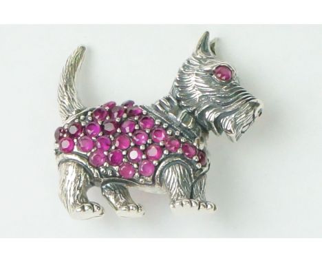 Silver dog brooch set with a ruby coat 