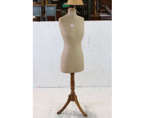 Female Shop Torso Mannequin with cloth covered body, raised on a turned wooden base with three splay legs, 147cm high 