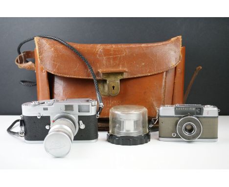 Leica M2 Leitz Wetzlar camera, dated 1959, serial no. 970991, with original carry strap, currently fitted with the Leica f/4 