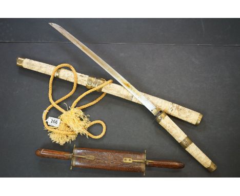 Japanese Wakizashi sword with single edged blade and sectional bone scabbard and hilt, with figural carved decoration and bra