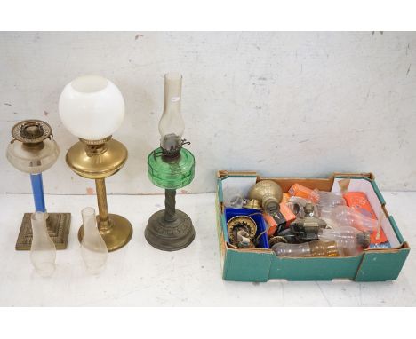 Three Victorian Oil Lamps, one brass with opaque shade, one with green glass well and brass base and the other glass well, ce
