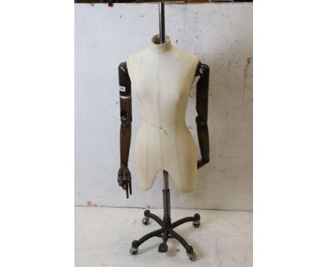 Female Shop Torso Mannequin with cloth covered head, wooden articulated arms and hands, mounted on an industrial style metal 