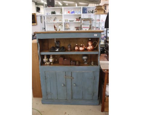 Pine cupboard of two doors &amp; shelf rack above, on plinth base