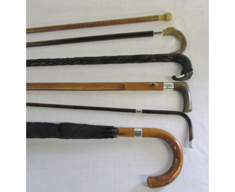 Various silver cuffed walking sticks, ebony elephant walking stick & a Swaine Adeney Brigg & Sons umbrella with silver mount.