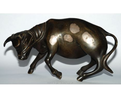 A Bronze Bull with silver inlaid patches, 7" long, 4" tall.