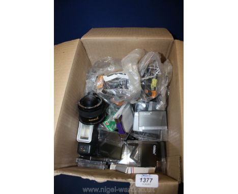 A quantity of camera Flashes and Cokin filter boxes