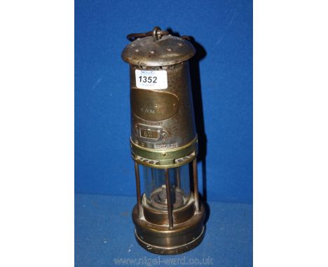 A Brass miner's Davy Lamp, marked N.C.B. Wyllie' no. 62