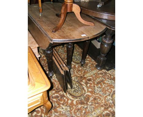 An unusual Victorian Oak pull apart drop-leaf, six leg oval extending Dining Table with moulded edge curved top and drop leav