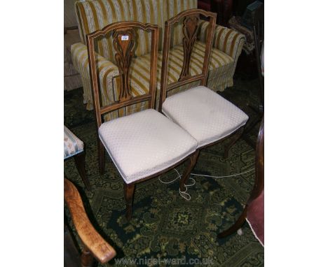 A pair of Edwardian light Rosewood inlaid Bedroom Chairs with shaped top rail over elegant fret-cut and pierced splat with fl